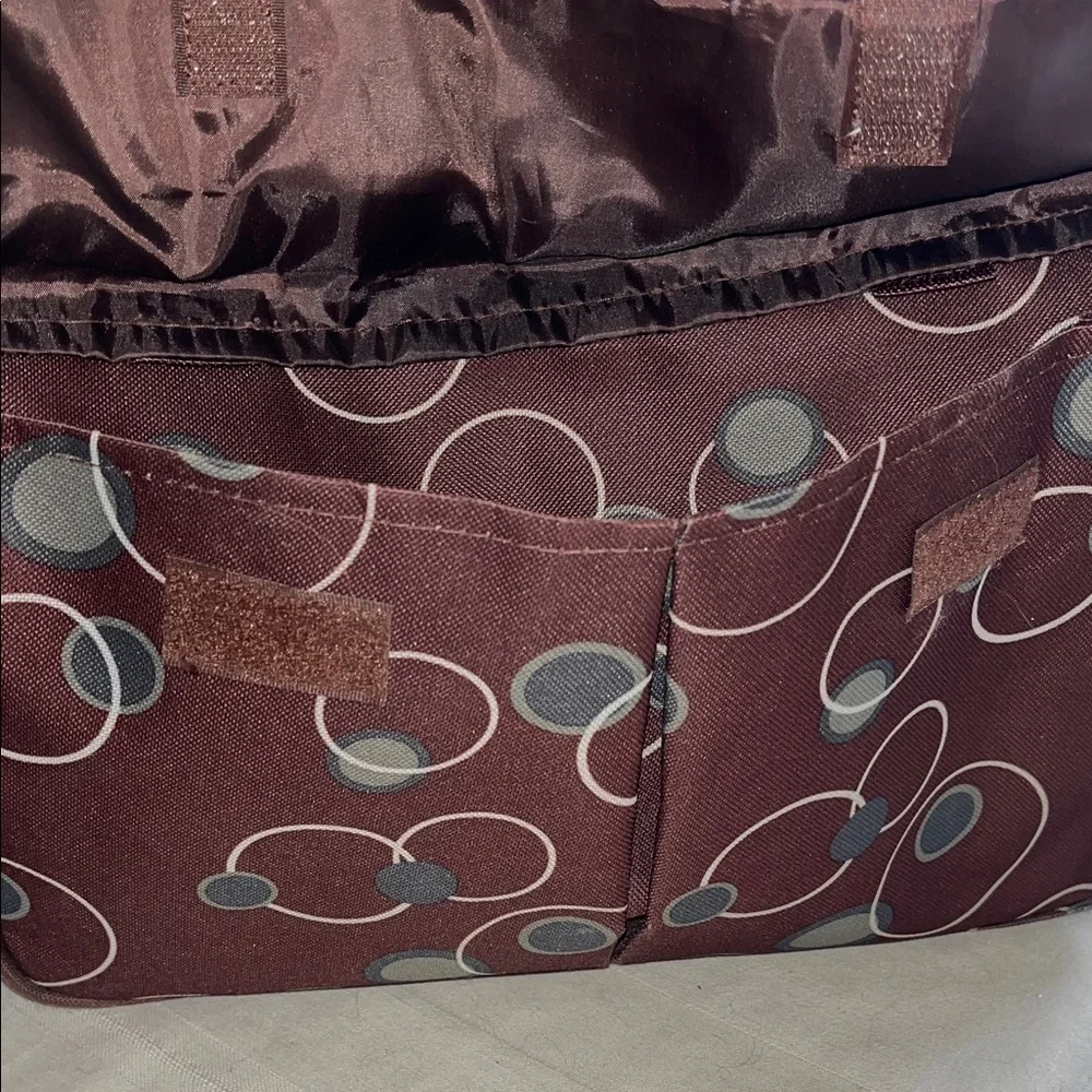 All purpose Brown Polka Dot Vinyl Tote Bag Open at top with side pockets.